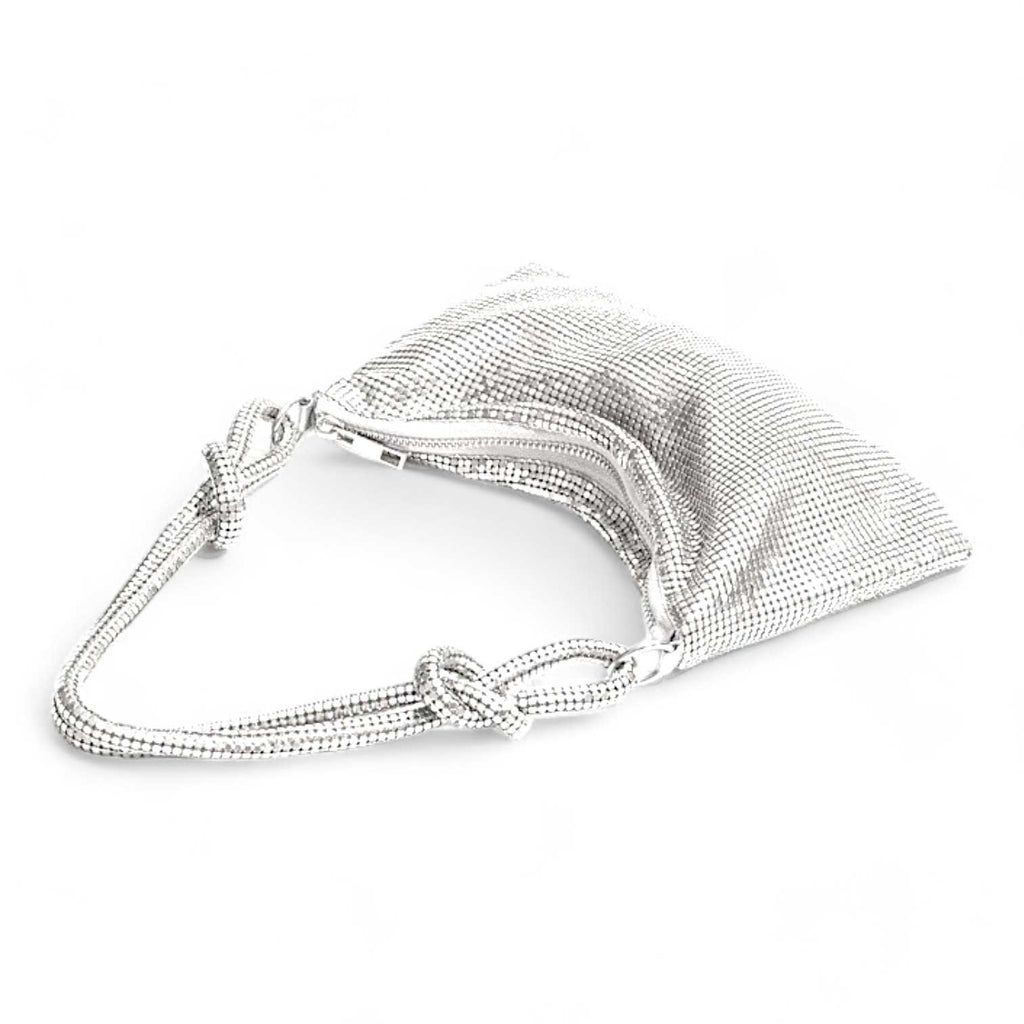 Glomesh purse
70s vintage-inspired
Shimmer purse
Evening bag
Knotted strap detail
Glamorous purse
After Dark purse collection
Shiny evening clutch
Sleek black purse
Gilded gold purse