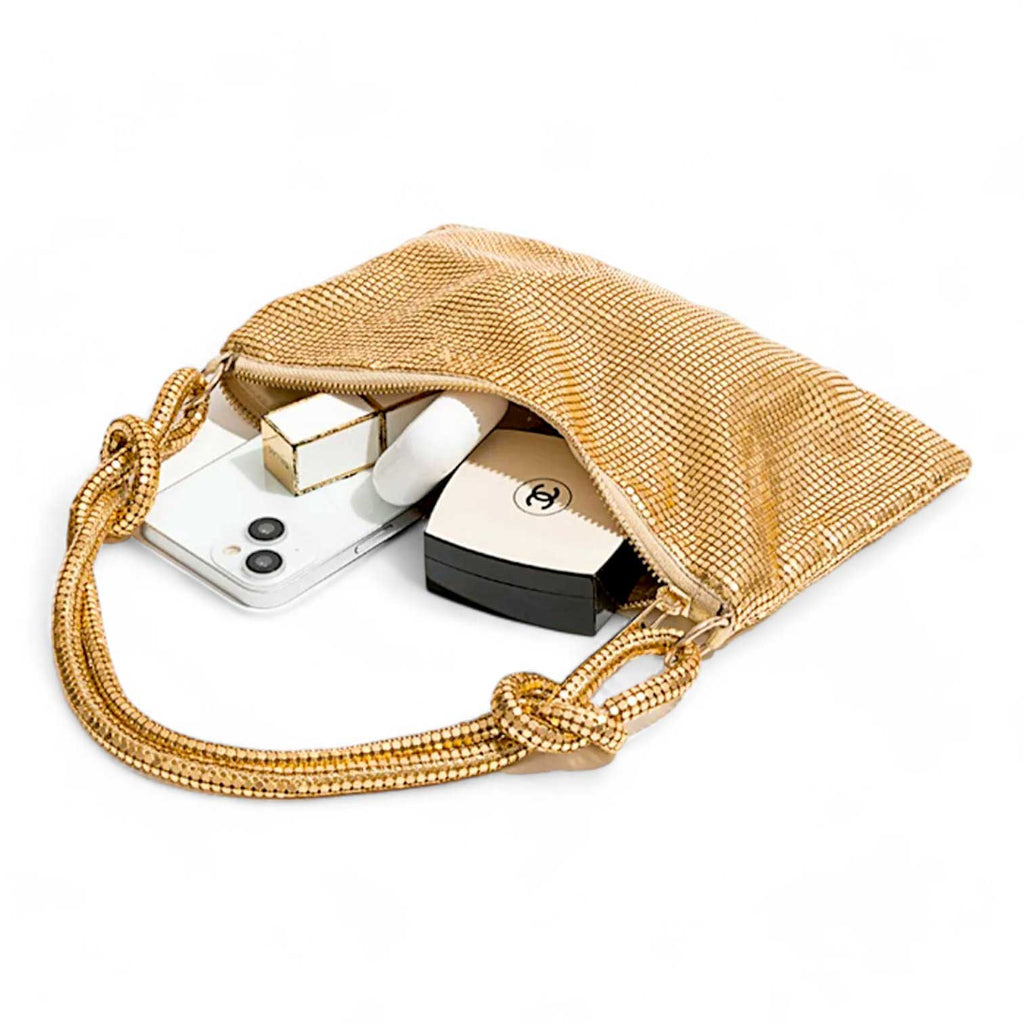 Glomesh purse
70s vintage-inspired
Shimmer purse
Evening bag
Knotted strap detail
Glamorous purse
After Dark purse collection
Shiny evening clutch
Sleek black purse
Gilded gold purse